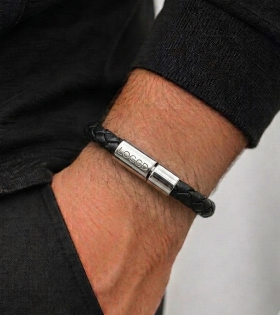 Men's black braided leather bracelet with a high-polish silver magnetic clasp on a white background."