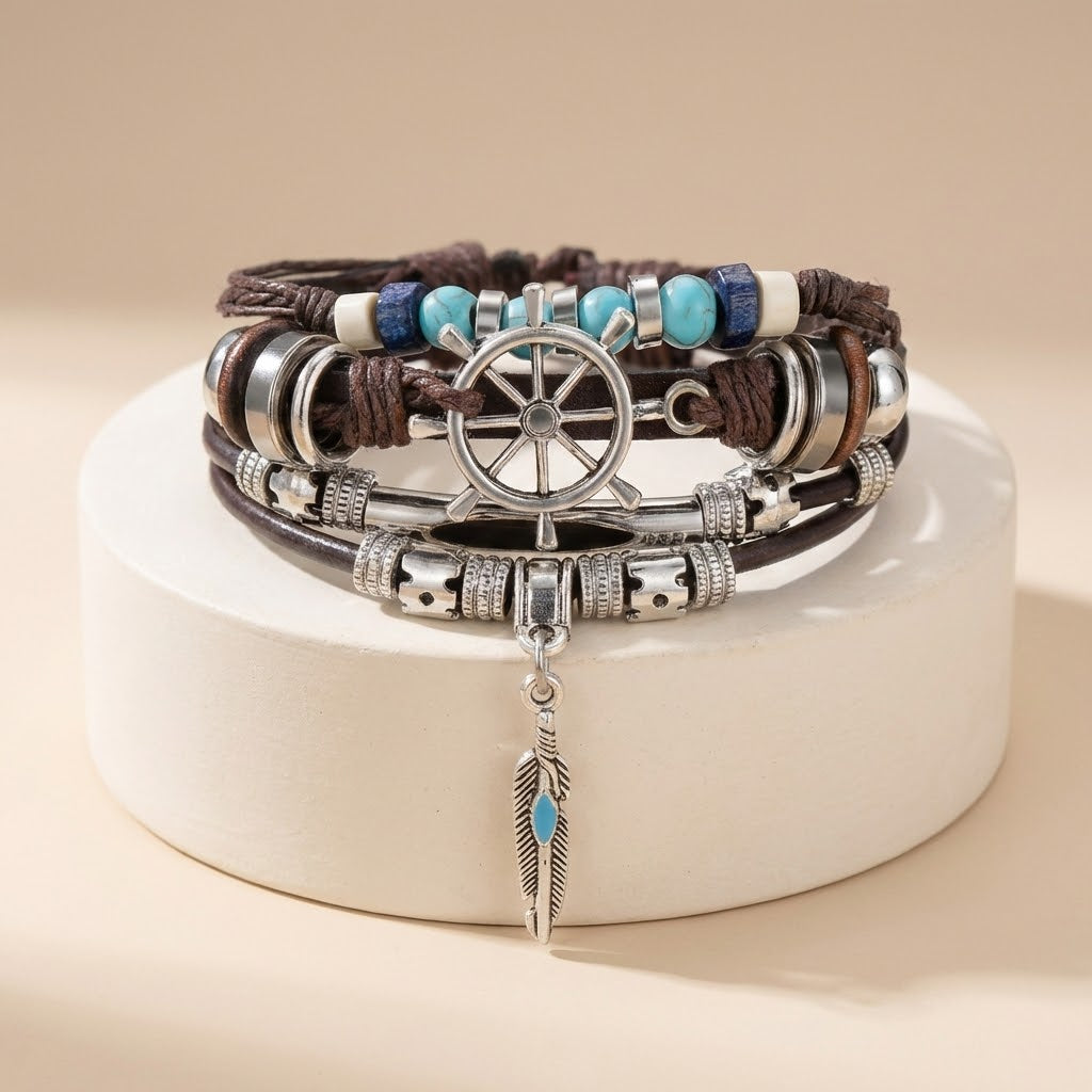 Stack of bracelets with decorative elements on a beige background