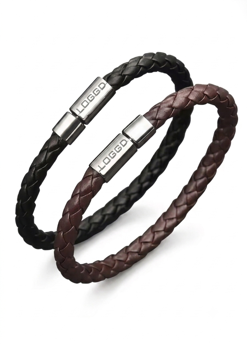 Close-up of a premium minimalist braided leather bracelet for men, featuring a sleek, reflective stainless steel silver clasp.
