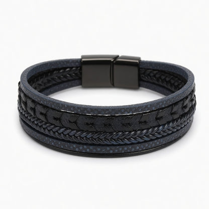 Multi-layer blue men's bracelet featuring braided leather and textured industrial steel strands with a matte black magnetic clasp.